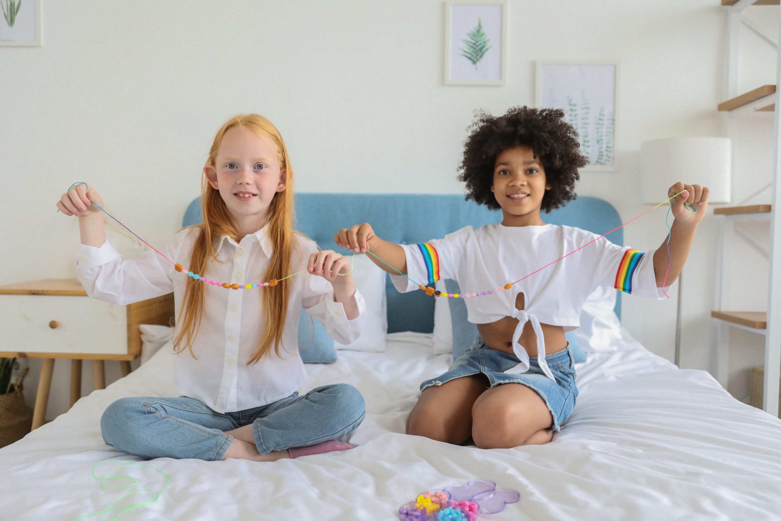 Girls holding bracelets